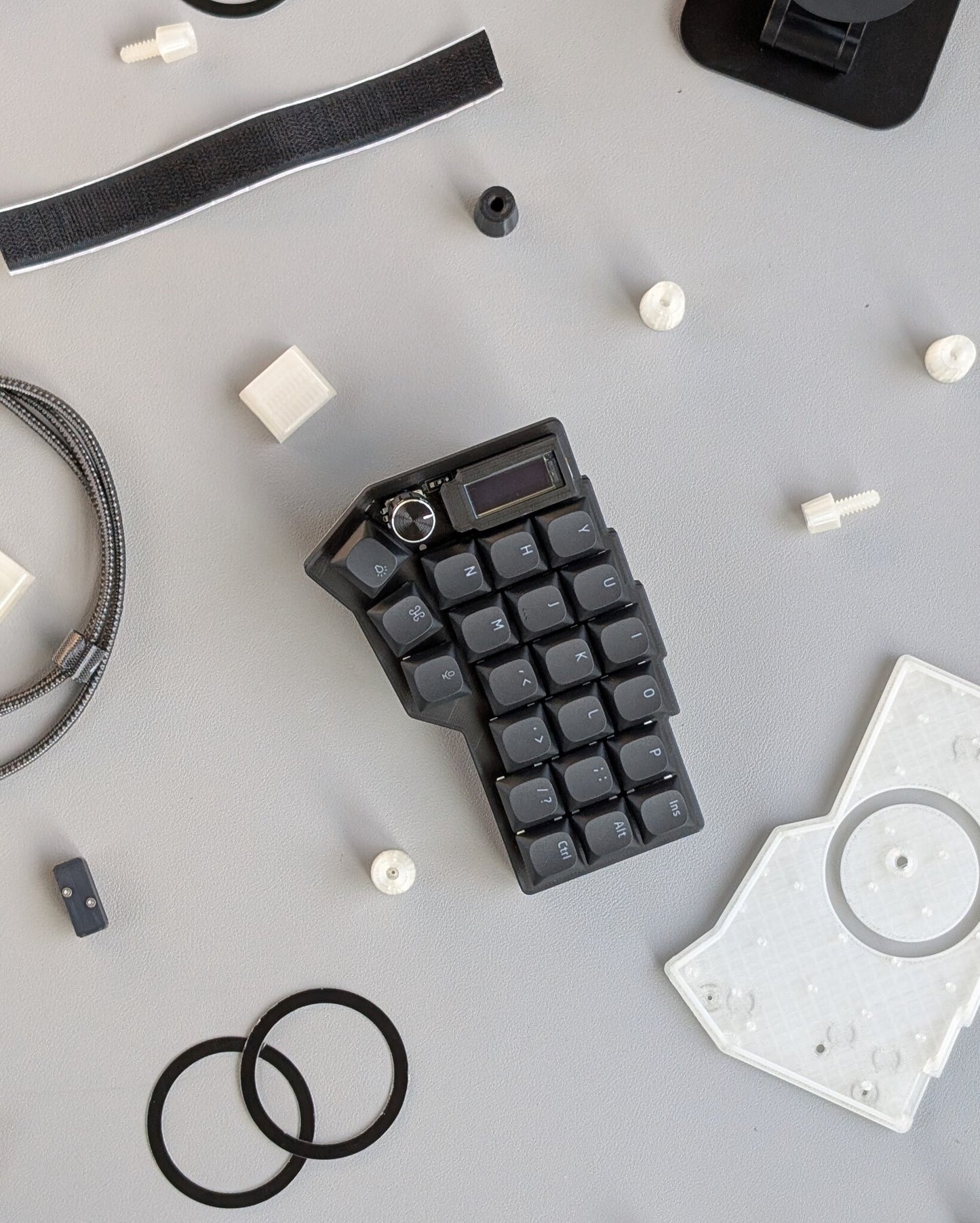 mechanical split keyboard surrounded by keyboard parts