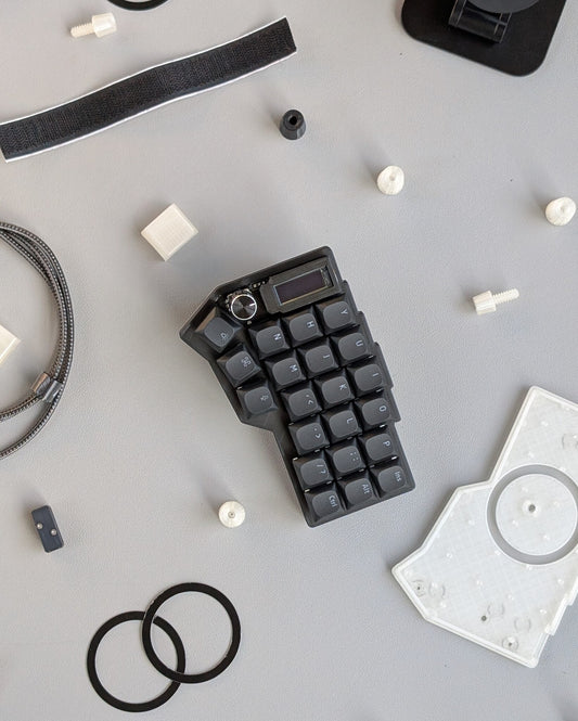 mechanical split keyboard surrounded by keyboard parts