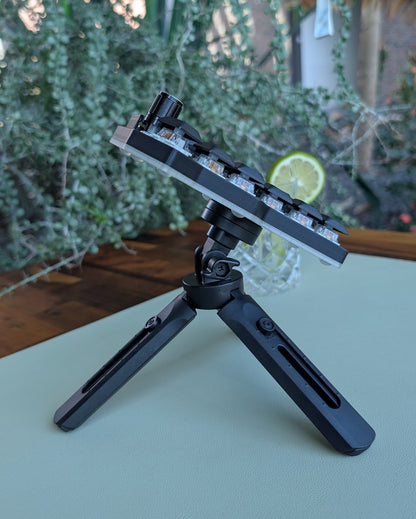 mechanical split keyboard on tripod